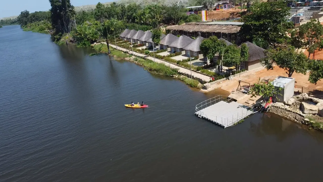 Aerial view of guests kayaking near the resort's floating river dock